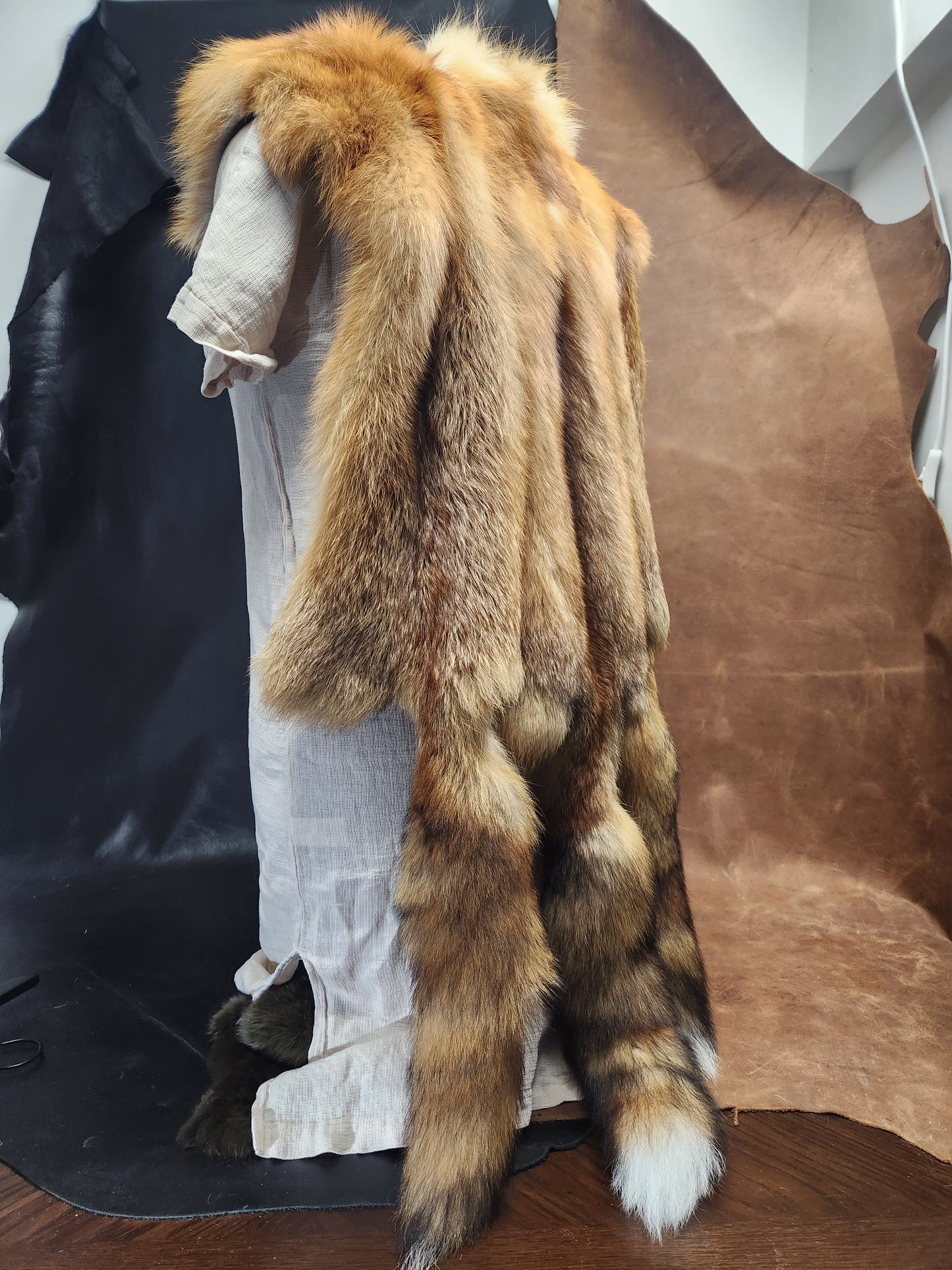 Triple Red Fox Mantle on Brown Leather