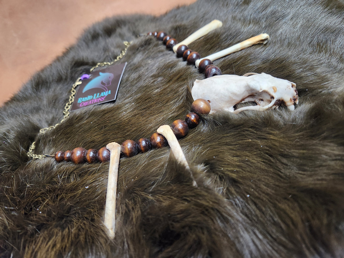 Mink skull, Coyote Foot Bone, and Wooden Bead Necklace