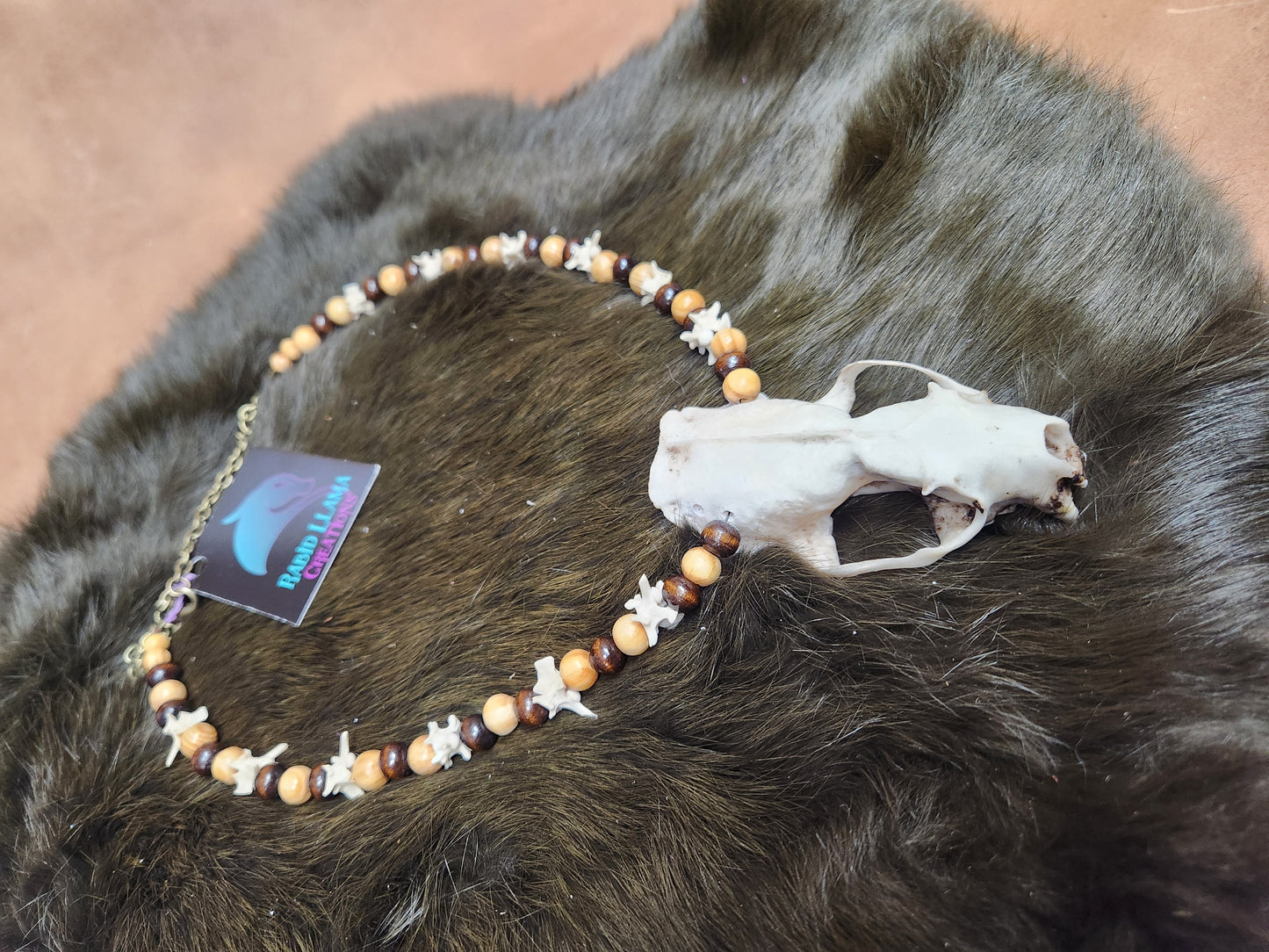 Mink skull, Rattlesnake Vertebrae, and Wooden Bead Necklace