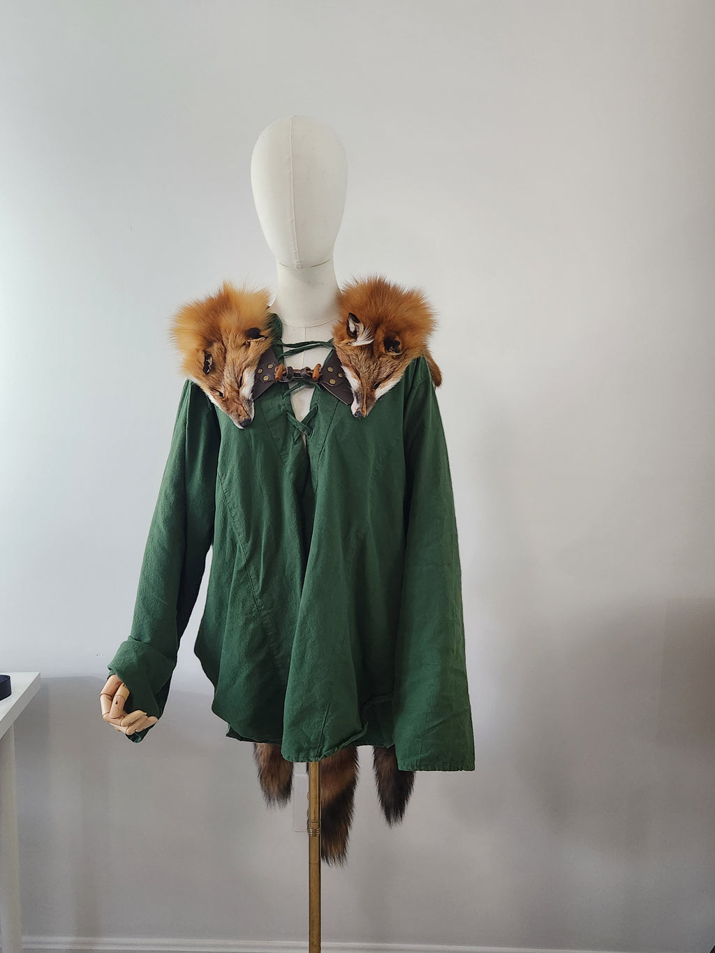 Triple Red Fox Mantle on Brown Leather