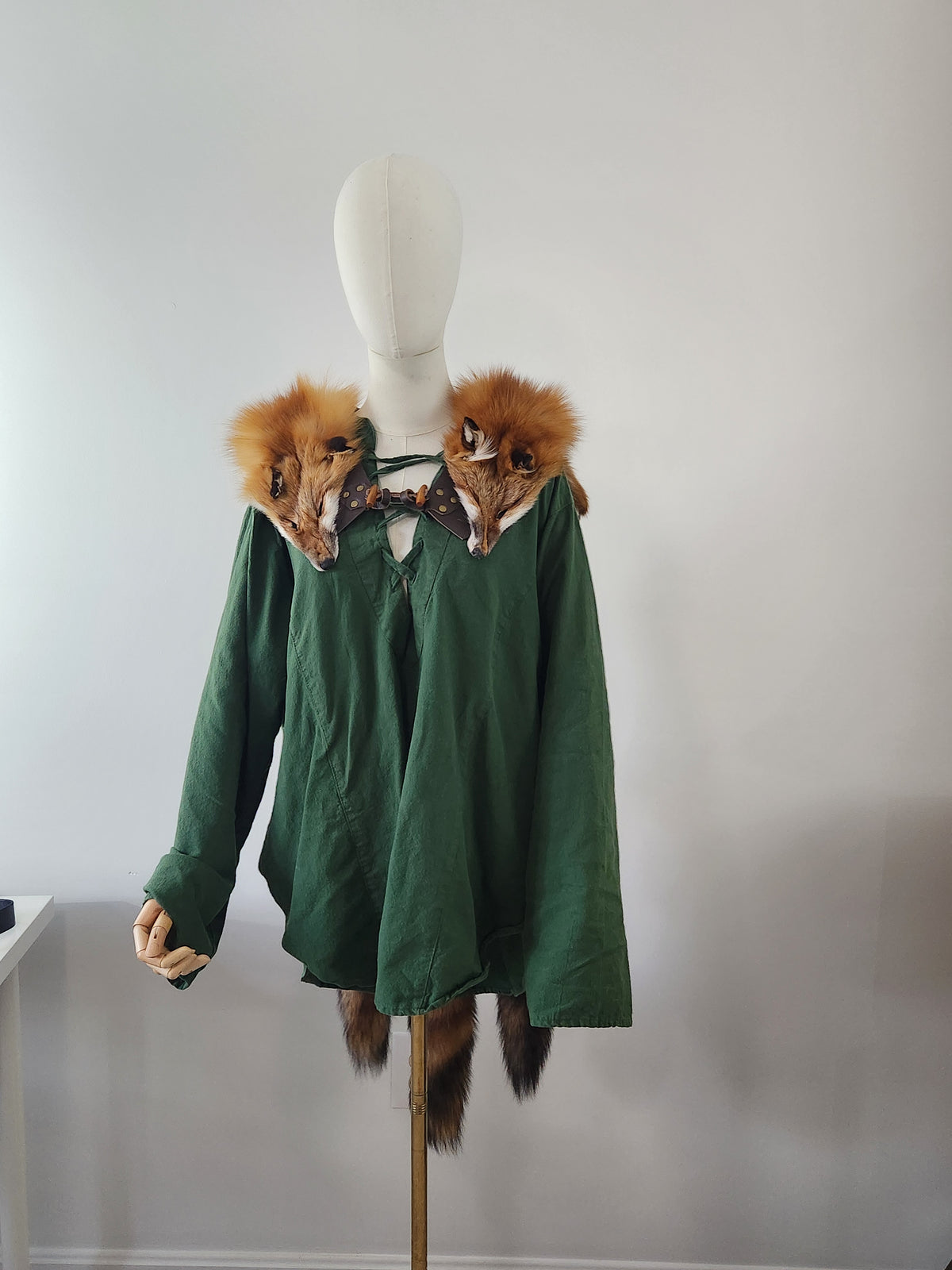 Triple Red Fox Mantle on Brown Leather